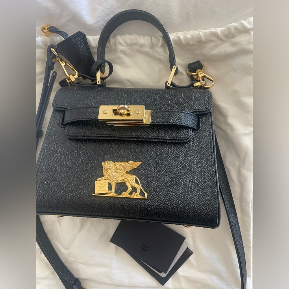 Black mini MCM bag in good condition.